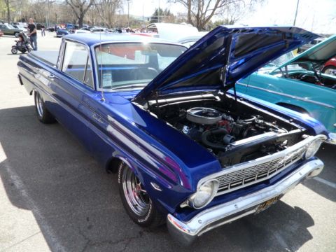 1973 Ford Ranchero - Blue 1963 Ford Falcon Ranchero at a car show, hood open revealing the engine bay.