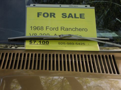 1973 Ford Ranchero - A "FOR SALE" sign on the windshield of a 1968 Ford Ranchero lists the price and phone number.
