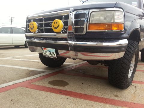 1995 Ford Bronco - This 1995 Ford Bronco features custom smiley face auxiliary lights mounted on its chrome grille guard.