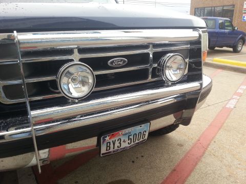 1995 Ford Bronco - Front view of a 1995 Ford Bronco, its grille, auxiliary lights, and a Texas license plate.
