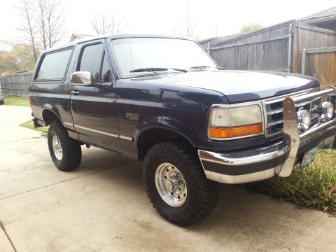 1995 Ford Bronco - This 1995 Ford Bronco features a chrome grille guard and aftermarket wheels, giving it a appearance.