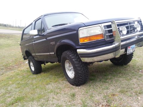 1995 Ford Bronco - This 1995 Ford Bronco features a chrome grille guard and large off-road tires.