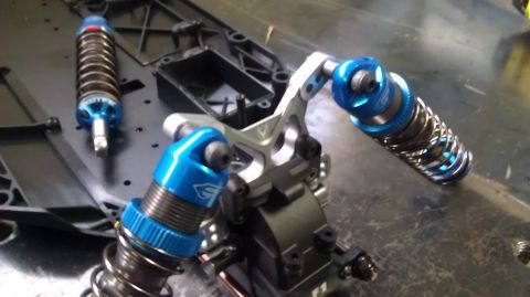 1996 Ford Bronco - Close-up of RC car shock absorbers and suspension components.
