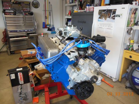 1979 Ford F-150 - Engine on a stand, likely undergoing a rebuild or swap, with various tools and parts visible in the background.