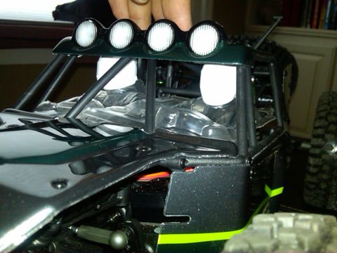 1986 Ford Bronco - Interior view of a remote control buggy, showing the roll cage and light bar.