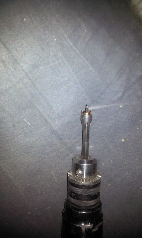 1967 Ford F-100 - A close-up view of a drill bit and its chuck, with website text at the bottom.