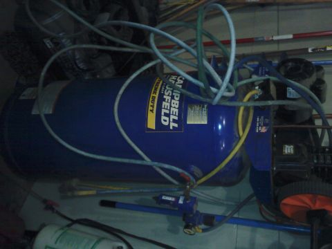 1978 Ford Bronco - Campbell Hausfeld air compressor with extreme duty label visible on the blue tank.