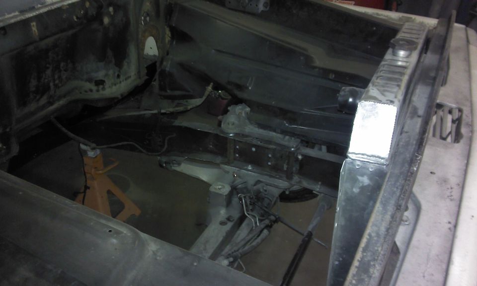 1967 Ford F-100 engine bay with radiator and jack stands