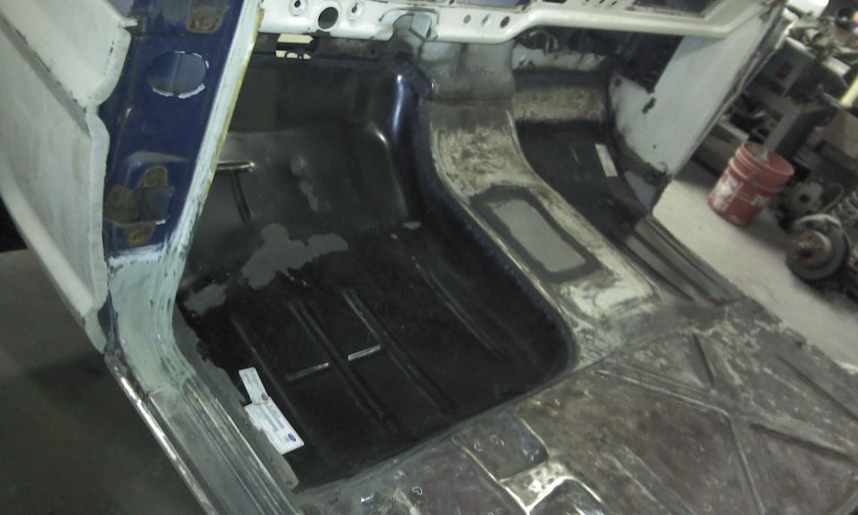 Truck cab floor and transmission tunnel under repair