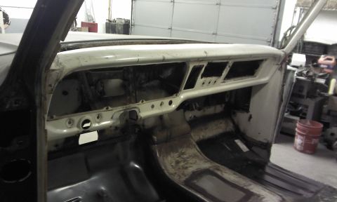 1967 Ford F-100 - Interior view of a 1967 Ford F-100, dashboard removed, showing the dash structure and floor.