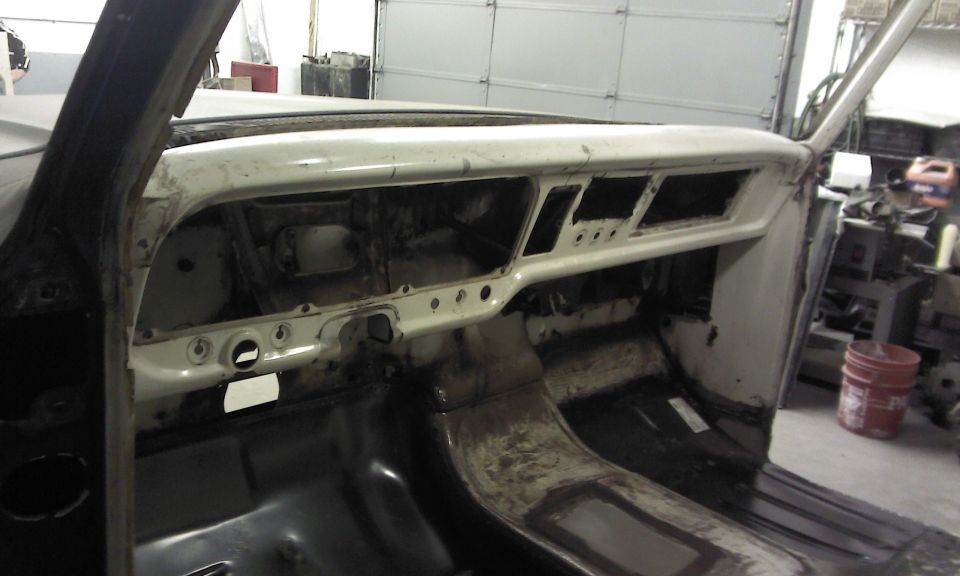 1967 Ford F-100 interior showing disassembled dashboard and floor pan