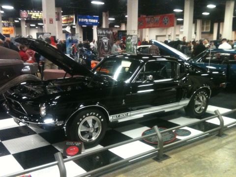 2004 Ford Crown Victoria - This black 1967 Ford Mustang GT500 is on display at a car show.