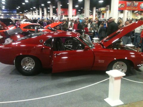 2004 Ford Crown Victoria - This modified 1969 Ford Mustang Boss 302 is displayed with its hood open at a car show.