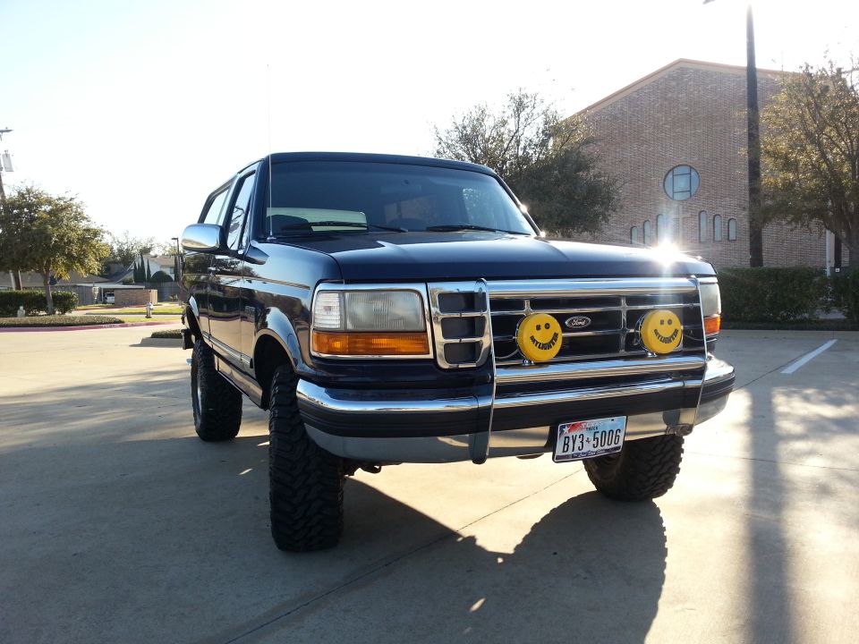 1995 Ford Bronco front view with custom grille and smiley face fog lights