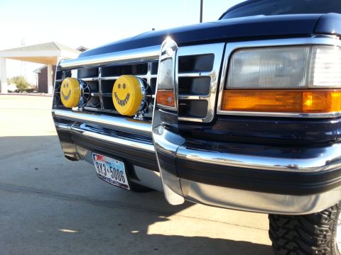 1995 Ford Bronco - This 1995 Ford Bronco features a chrome bumper and distinctive yellow smiley face auxiliary lights.