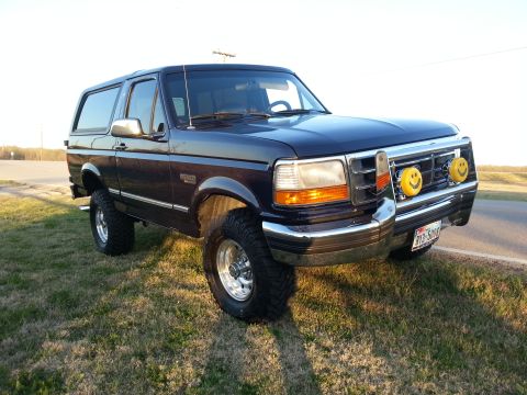 1995 Ford Bronco - This lifted 1995 Ford Bronco has custom smiley face fog lights and chrome wheels.