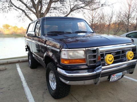 1995 Ford Bronco - This lifted 1995 Ford Bronco features a chrome grille guard and distinctive smiley face fog lights.