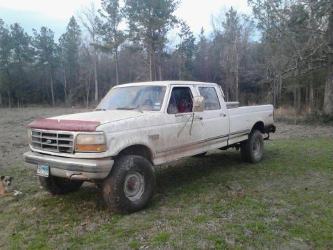 1990 Ford Bronco - This white Ford F-250 pickup truck appears to be from the early 1990s, not a 1990 Ford Bronco.