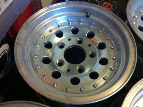 1992 Ford F-150 - A close-up view of a single aluminum alloy wheel, showing its intricate design and bolt pattern.