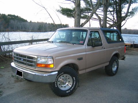 1996 Ford Bronco - This 1996 Ford Bronco is seen from a 3/4 front angle near a body of water.