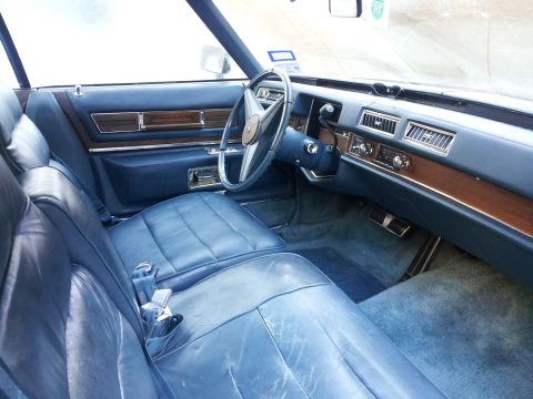 2008 Subaru Legacy - Interior view of a classic Cadillac Eldorado, blue leather seats and wood trim on the dashboard.