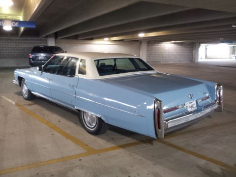 2008 Subaru Legacy - This light blue 1977 Cadillac sedan features a white vinyl roof and is parked in a garage.