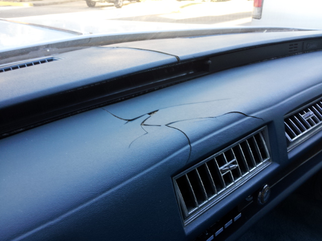 Cracked dashboard with air vents visible