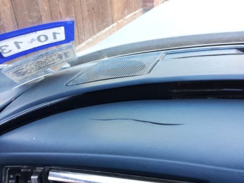 2008 Subaru Legacy - Cracked dashboard interior with a license plate frame visible.