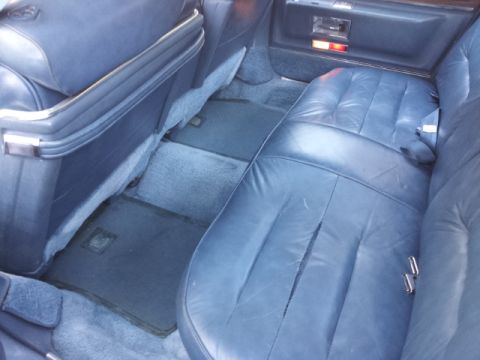 2008 Subaru Legacy - The interior of a car shows blue leather seats and floor mats.