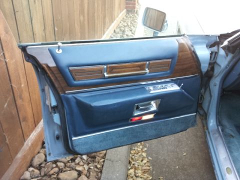 2008 Subaru Legacy - The interior door panel features blue fabric and wood grain accents.
