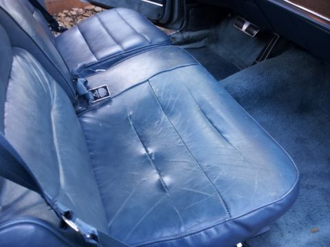 2008 Subaru Legacy - Interior shot of a car showing blue leather seats and matching carpet, with a seatbelt fastened.