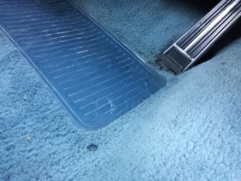 2008 Subaru Legacy - Close-up of the driver's side floor mat and brake pedal in a vehicle.