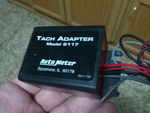 1998 Ford Crown Victoria - Auto Meter Tach Adapter, Model 9117, made in Sycamore, IL.