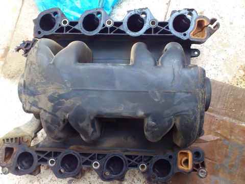 1998 Ford Crown Victoria - This is a Ford Crown Victoria intake manifold, likely from a 1998 model, shown removed from the engine.