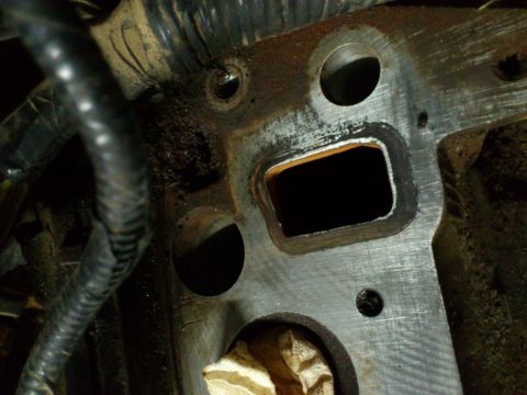 1998 Ford Crown Victoria - This is a close-up view of an engine intake manifold part, showing its internal structure and mounting points.