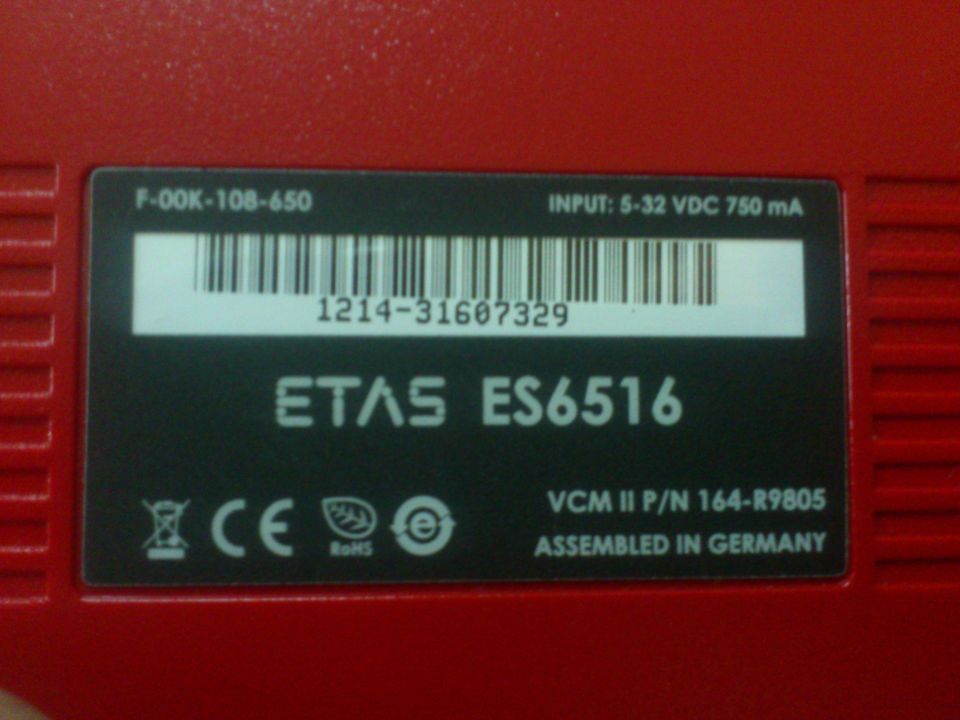 Red ETAS ES6516 diagnostic tool with barcode and VCM II P/N 164-R9805 label