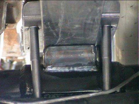 1979 Ford Bronco - This image shows a close-up view of a custom-fabricated suspension component, possibly for a vehicle's rear axle.