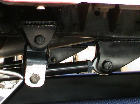 1979 Ford Bronco - Close-up view of the undercarriage suspension system of a vehicle.