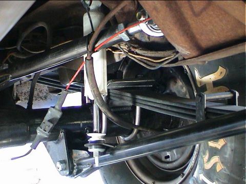 1979 Ford Bronco - Close-up view of the rear suspension system, showing leaf springs and shock absorbers.