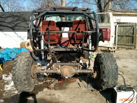 1986 Ford Bronco - This heavily modified SUV features a custom roll cage, oversized tires, and a lifted suspension, suggesting it's built for off-road use.