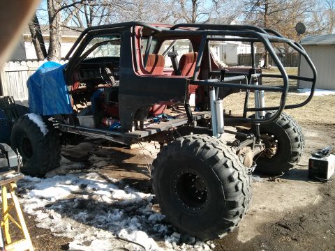 1986 Ford Bronco - This 1986 Ford Bronco is being heavily modified with a custom roll cage and oversized tires for off-road use.