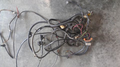 1973 Chevrolet Camaro - Automotive wiring harness spread out on a concrete surface, showing complex wiring and connectors.