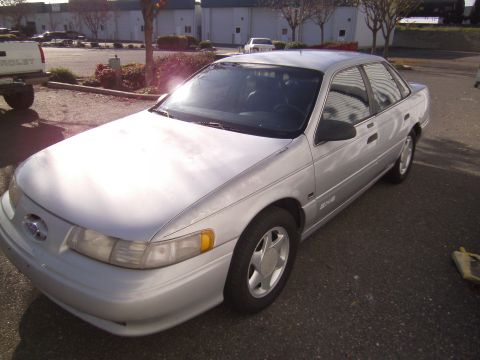 1992 Ford Taurus - Silver 1992 Ford Taurus sedan seen from a 3/4 front angle.