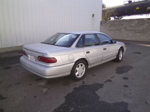 1992 Ford Taurus - This 1992 Ford Taurus sedan is shown from the rear three-quarter angle.