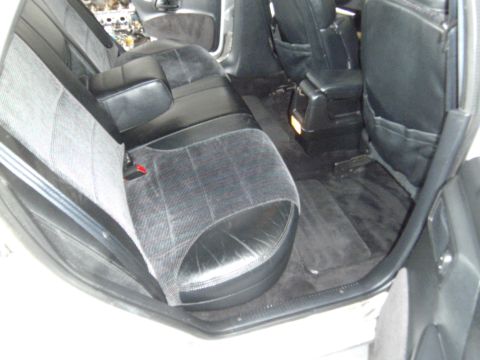 1992 Ford Taurus - The interior of a car is shown, focusing on the rear seating area and floor mats.