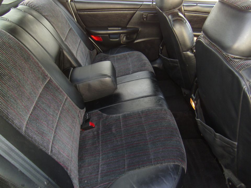 1992 Ford Taurus interior rear seats with patterned fabric and black leather