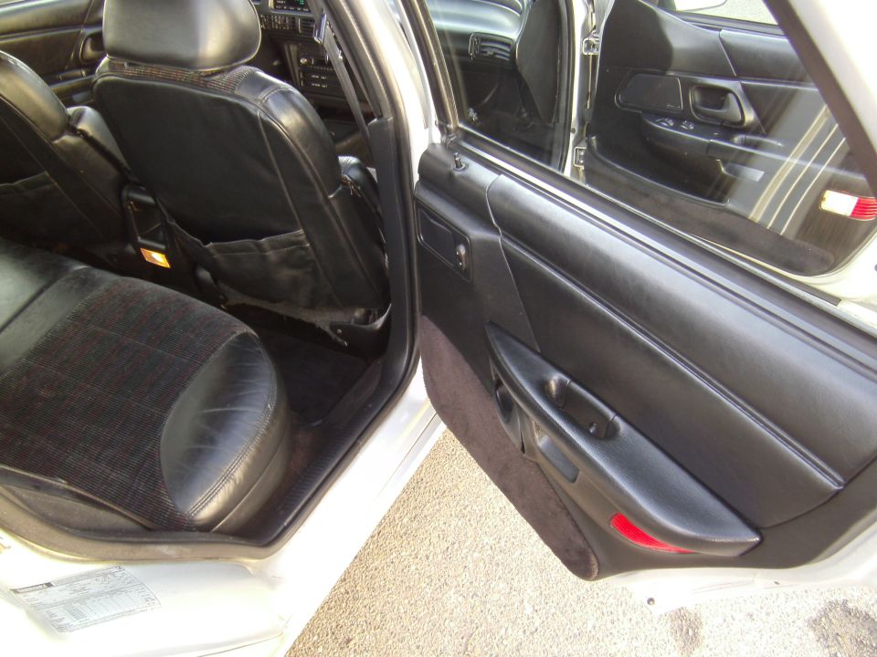 1992 Ford Taurus interior showing front passenger door panel and rear seats