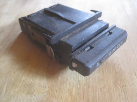 1993 Ford Bronco - This part is a rear defogger switch, likely from an older vehicle.