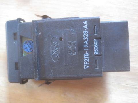 1993 Ford Bronco - This is a Ford branded electronic part, likely a switch or relay, made in Canada.