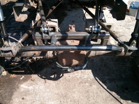 1986 Ford Bronco - Custom suspension components are visible on a vehicle's rear axle.